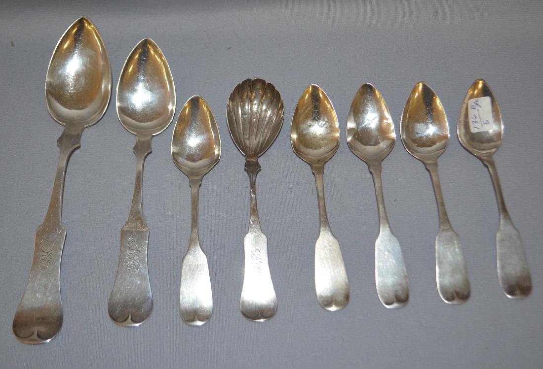 Eight American Coin Silver Fiddleback Spoons: Eight American Coin Silver Fiddleback Spoons: Numbers 1, 2 and 3 are by WW Gary. They are 8 1/4"; 7 1/4" and 6 1/8" long. The 6 1/8" spoon has a shell shaped bowl. The next five spoons are tea spoons 