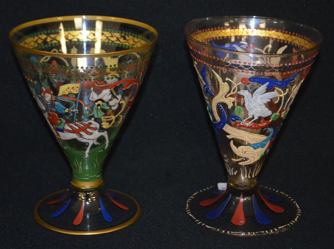 Two Antique Bohemian Blown Glass Beakers: Two Antique Bohemian Blown Glass Beakers with Enamel Decoration: 1.) With lions, eagles and dolphins.; 2.) With a man with a jug and feathered staff and another man on horseback with a banner and colo