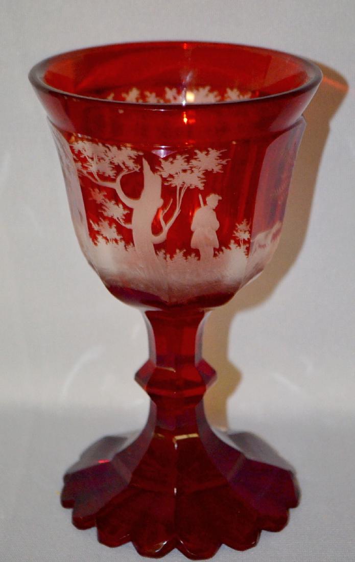 Antique Ruby Stained Goblet: Antique Ruby Stained Goblet with Skillfully Engraved Wrap Around Scenes: Includes a hunter with his weapon, a pointer dog and geese, trees and foliage and a stag and doe scene. Sells as is, where is. 