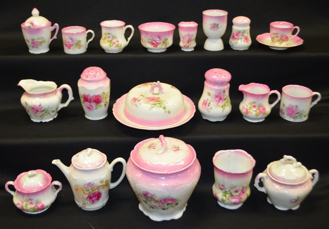 23pc Antique Luster China Set: Creamer and Sugar, cracker jar, butter dish, 2 muffineers, mustard, teapot with 4 cream and sugars, 4 mugs, shaker egg cup, childs waste bowl, spooner, and toothpick.