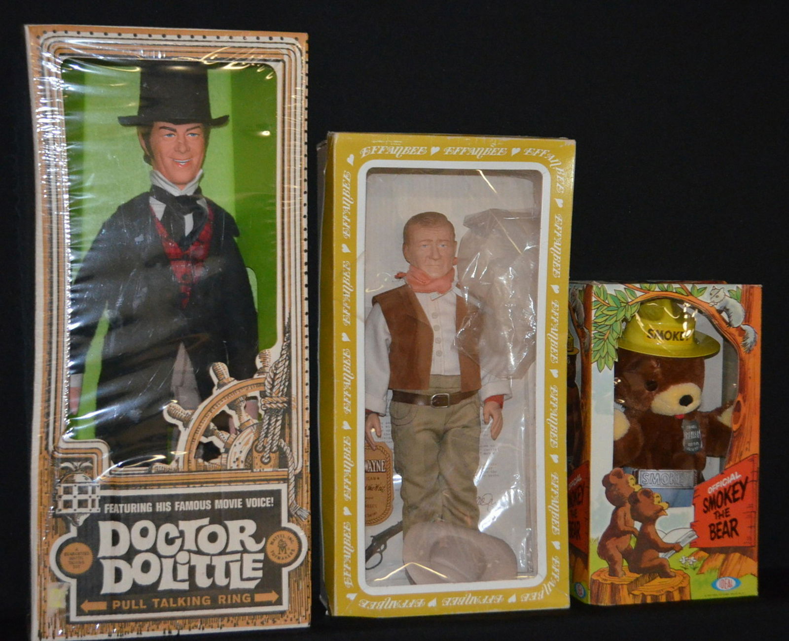 3 Male Dolls, NRFB: 3 Male Dolls, NRFB: 1967 Talking Doctor Dolittle; Effanbee John Wayne, No. 1981; Idea Smokey the Bear; 1967.