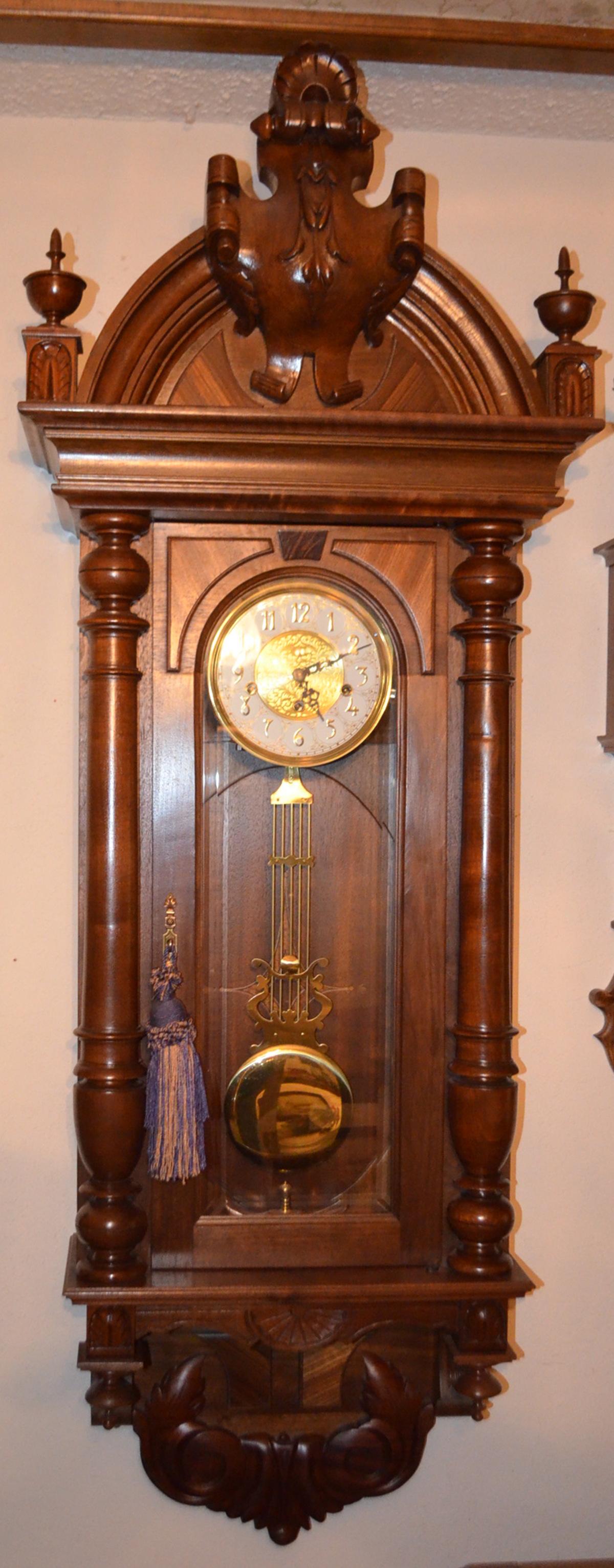 Super Carved Walnut Sligh Wall Clock: Fully Carved 47": Super Carved Walnut Sligh Wall Clock: Fully Carved 47" Walnut case with 3 train 8bar chiming mvmnt, Brass pendulum, bevelled glass, case carved by Allaire Sauer **Please note, this clock ships F.O.B.