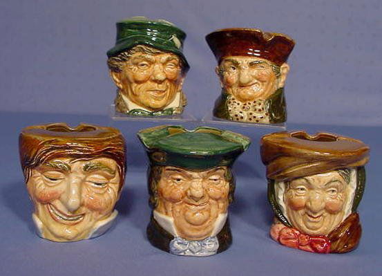 5 Royal Doulton Ash Receivers: 5 Royal Doulton Ash Receivers: 1.) Royal Doulton "Old Charley" Ash Receiver: marked with RD no.787515 for the year 1933. Also with impressed no.8232. Green marks. No condition problems. 3 1/4" tall 2.