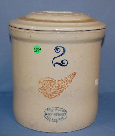 2 Gallon Red Wing Stoneware Crock with Lid: 2 Gallon Red Wing Stoneware Crock with Lid: marked with large 2, large Red Wing and oval Red Wing Union stamp in blue. The lid has an impressed 2 in one petal around the handle. (Production flaws.) 11