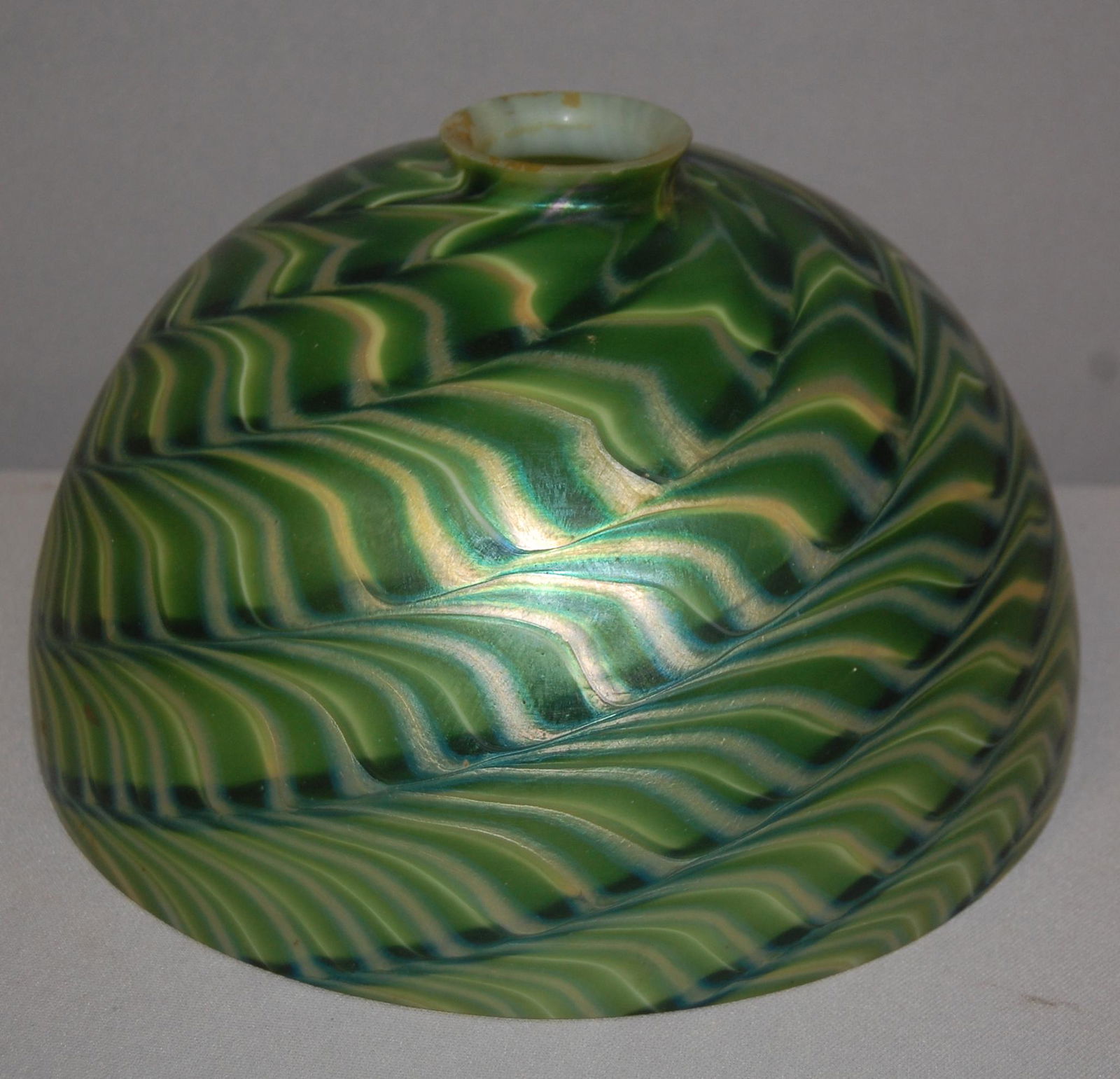 Reverse Swirl Loetz Style Lamp Shade. Loetz style art: Reverse Swirl Loetz Style Lamp Shade. Loetz style art glass lamp shade. 2.25 fitter 5.75" tall 10 1/8" cased art glass, beautiful luster.