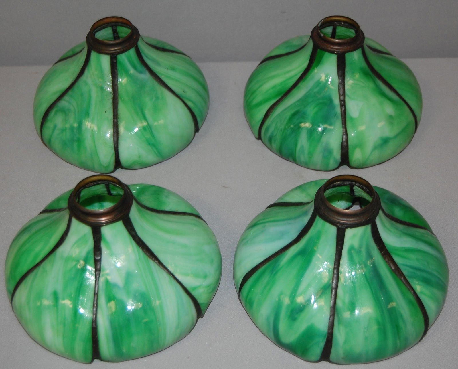 Set of 4 Slag Glass Lamp Shades. Each shade has 6 bent: Set of 4 Slag Glass Lamp Shades. Each shade has 6 bent slag glass panels, 2" fitters, 5.5" deep.