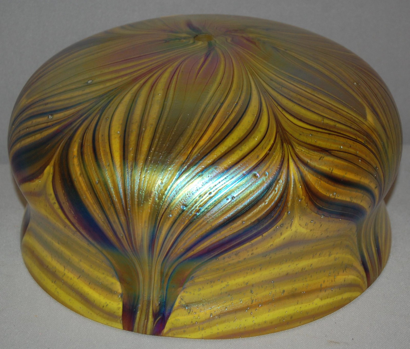 Domical Art Glass Shade: Domical Art Glass Shade. Czech Glass, not antique, drilled hole in center.Yellow & purple irridescent glass w/ pulled feather design. 9.75" Shade. Condition - No damages seen.