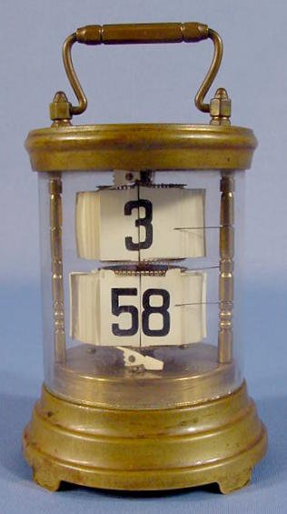 Plato Digital Clock: Plato Digital Clock in brass and glass case. Not running. (Wound tight.) 5 3/4" T including the handle.
