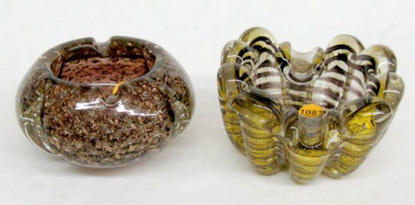 2 Murano Glass Ash Receivers: 2 Murano Glass Ash Receivers: 1.) Has wide ribs, in clear with gold specks glass. Inside is a continuous spiral of amethyst and white glass, 3" x 5 3/4" 2.) Light amethyst color with controlled air bu