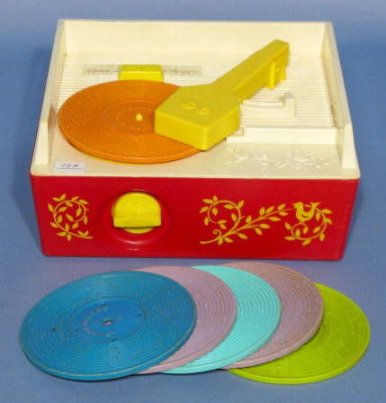 Fisher Price Toy Music Box Record Player: Fisher Price Toy Music Box Record Player: all hard plastic with 6 records. Made in a variety of bright colors. (Shows some use.) 4 1/4" x 9 1/4" x 8" and working at this time.qq All Items Sell As Is,