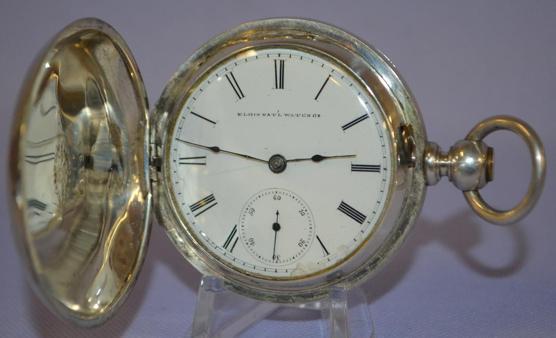 Elgin 11-17J Coin HC Pocket Watch. HC KW/KS. Full: Elgin 11-17J Coin HC Pocket Watch. HC KW/KS. Full gilded No. 709863, runs in a white No. K1194 coin silver case. Cover shows wear, and small dents. SSD has hairlines.