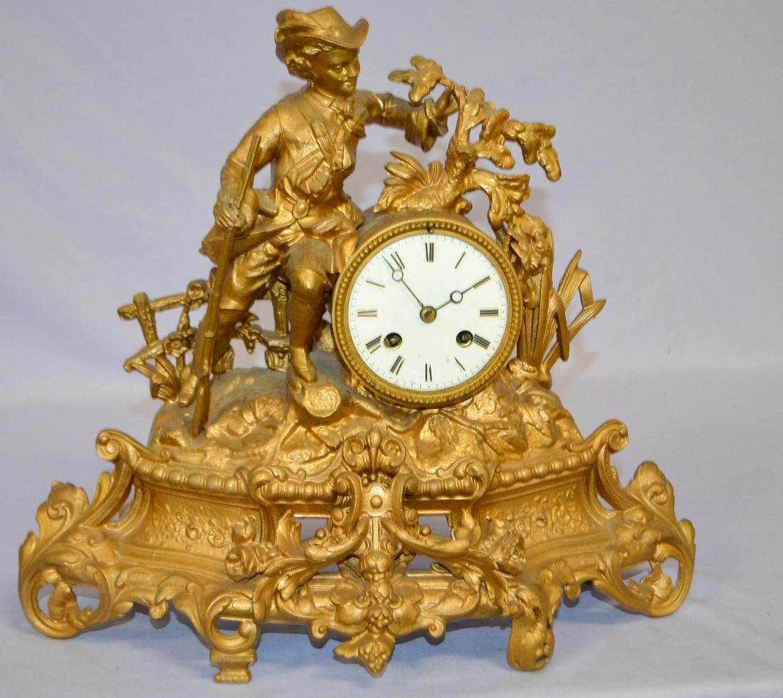 Antique Japy Freres French Mantle Clock: Antique Japy Freres French Mantle Clock. Iron Bronzed case painted man with rifle statue. 3 1/2" metal dial no glass, Japy Freses signed movement. 14" x 16"