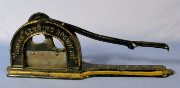 Cast Iron Arrow Tobacco Cutter: Cast Iron Arrow Tobacco Cutter: counter top style. Made for Cowan Lenning Brown Co. No town given. (Some paint is worn.) 7" t x 18" l All items sell As Is, Where Is, no guarantees of any kind. We acce