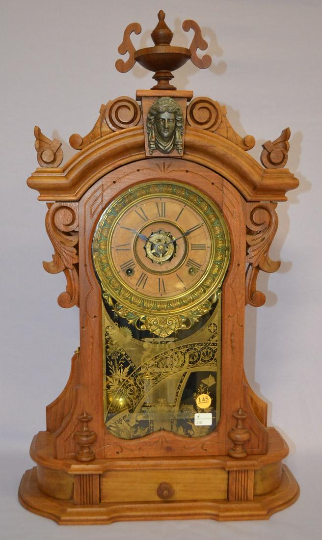 Antique Ansonia (Monarch) Walnut Mantle Clock: Antique Ansonia (Monarch) Walnut Mantle Clock, 6 " dial fancy sash green & brass signed, signed movement, T&S, with alarm, 2 barrel pendulum, carved walnut case, good old glass, label on back, pull ou