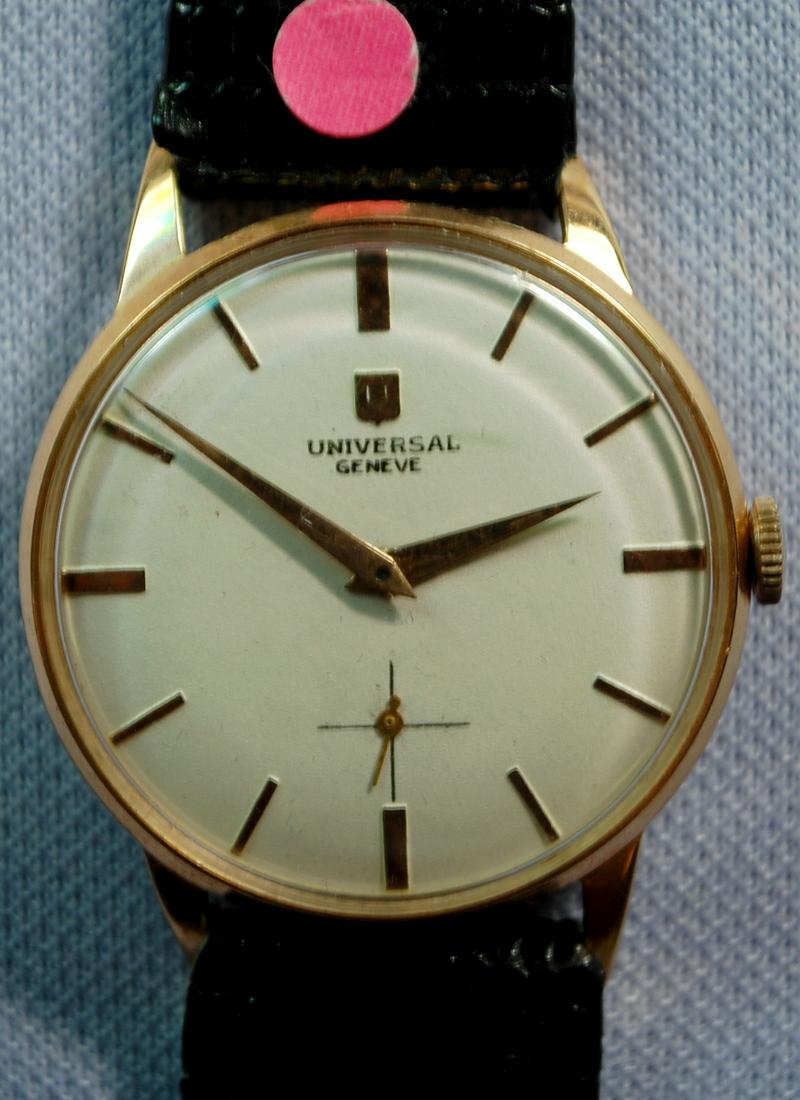 18K YG Universal Geneve Mens 17J Wrist Watch: 18K YG Universal Geneve Mens 17J Wrist Watch: grade 330, Swiss presentation with date 1963 on the back, not opened, white dial with gold features, running.