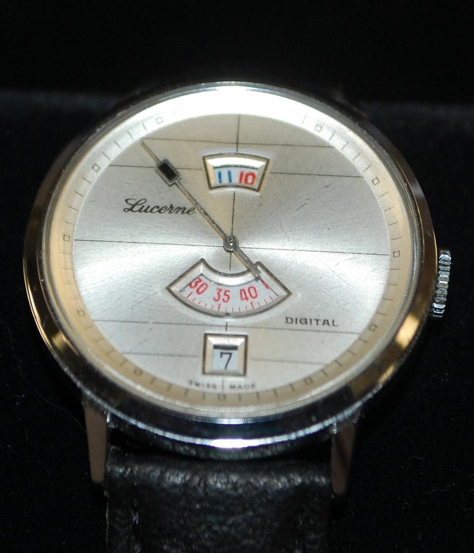 Lucerne Digital Dial Men's Wrist Watch: Lucerne Digital Dial Men's Wrist Watch: base metal case, digital dial displays hours, minutes and date in windows, with sweeps second hand, black leather band, running.