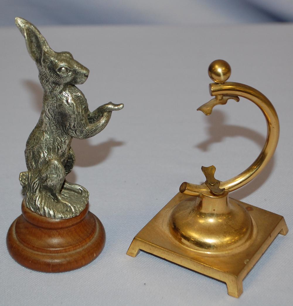 2 Pocket Watch Holders: 2 Pocket Watch Holders: 1) Cast Rabbit statue on wood base, stamped "Edles - Zinn"? 2) Brass holder with some tarnish