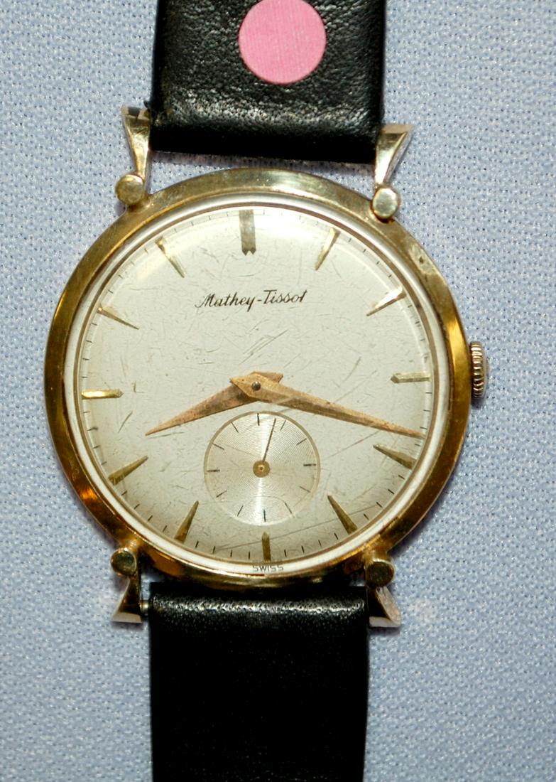 14K YG Mathey Tissot Mens 17J Wrist Watch: 14K YG Mathey Tissot Mens 17J Wrist Watch: very thin, unadjusted, the round silver dial has a scattering of dark spots and gold features, running, case back is 3.7 DWT, bezel not marked, crystal is sc