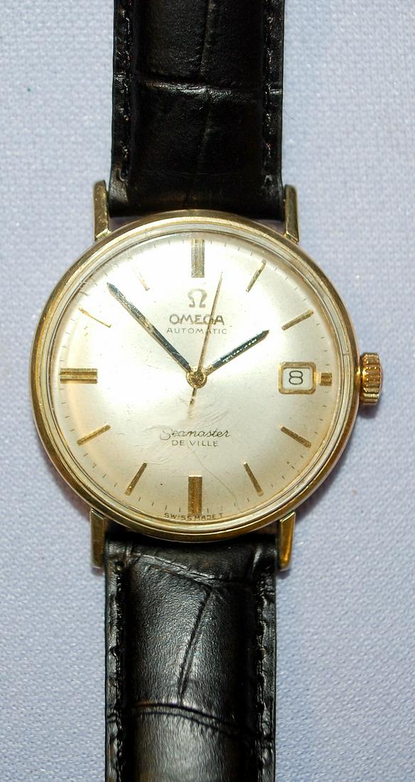 Omega Seamaster DeVille Automatic Wrist Watch: Omega Seamaster DeVille Automatic Wrist Watch: 17J autowind movement, 14K GF case, signed dial with date in good condition, minor paint loss on hands, black leather Hadley Roma band, running.