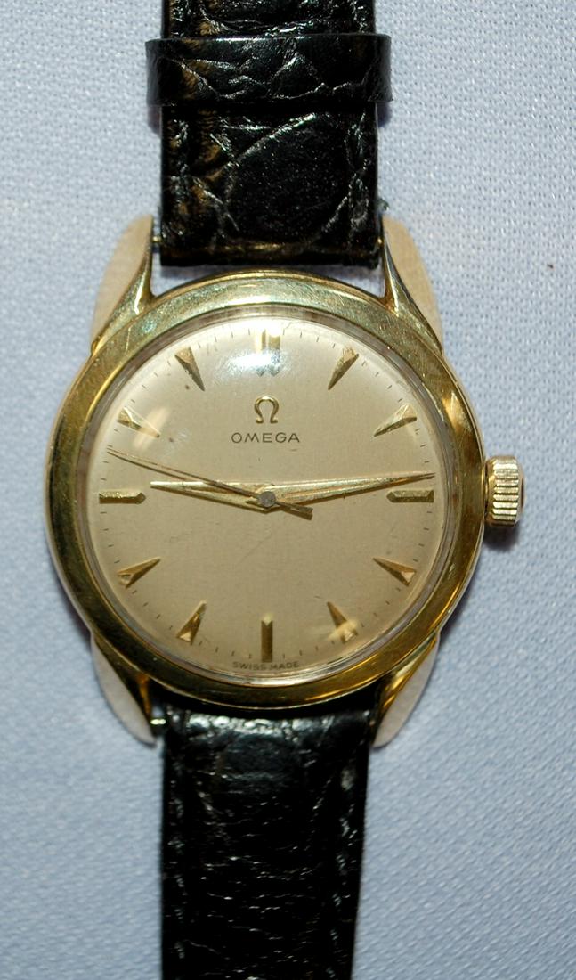 Omega 17J Men's Wrist Watch: Omega 17J Men's Wrist Watch: Omega 420 17J movement in stainless steel case with gold plate bezel, Omega dial in very good condition, black leather replacement band, running.