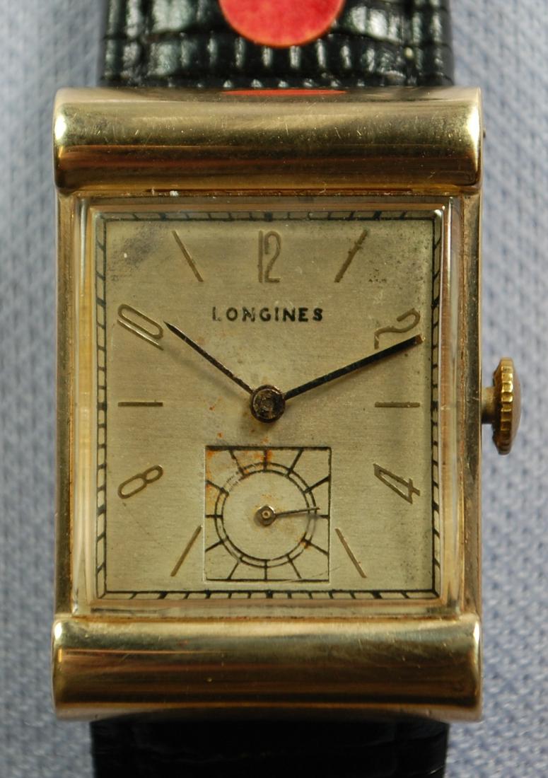 14K YG Longines 17J Men's Wrist Watch: 14K YG Longines 17J Men's Wrist Watch: number 64998286, number in the case is 441350, the dial has darkened, the minute hand is with but not connected to the watch, on a leather band, running.