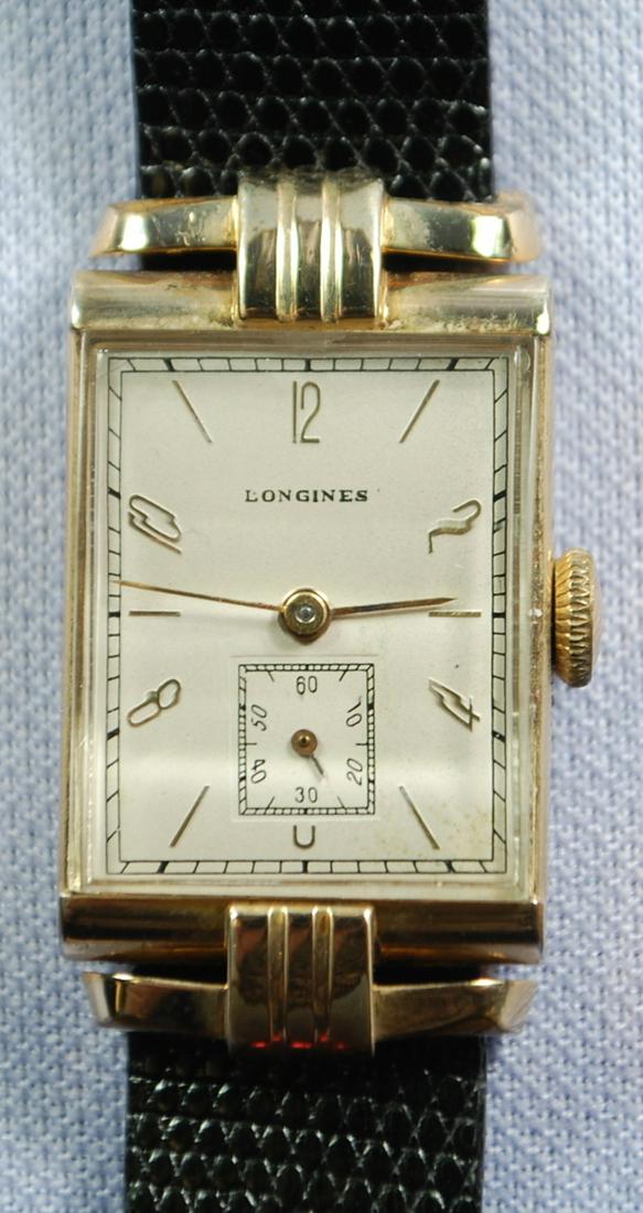 10K GF Longines Men's Wrist Watches: 10K GF Longines Men's Wrist Watches: F&B curved crystal, 17J unadjusted, number 6319242, the rectangular dial is gold with black and gold features, there is discoloration in the 3 to 6 area, case numb