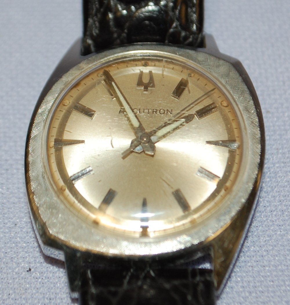 Bulova Accutron RF #223 Wrist Watch: Bulova Accutron RF #223 Wrist Watch: 214 movement, clean battery compartment, stainless steel case with edge wear and scrapes, nice dial, black leather band, not running.
