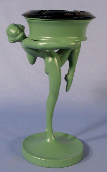 Frankart Ash Tray Holder Similar to No.T301: Frankart Ash Tray Holder Similar to No.T301: the base on this one is round, marked and has CP801 on it. (The green paint is not original. The black glass souvenir ashtray is not original.) 8 1/2" tall
