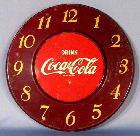 Coca Cola 1951 Metal Wall Clock by Telechron: Coca Cola 1951 Metal Wall Clock: made by Telechron Co., made of aluminum. (Not working. The hands are gone, also the cord. There are some scuff marks on the front.) 17 1/2" wide All items sell As Is,
