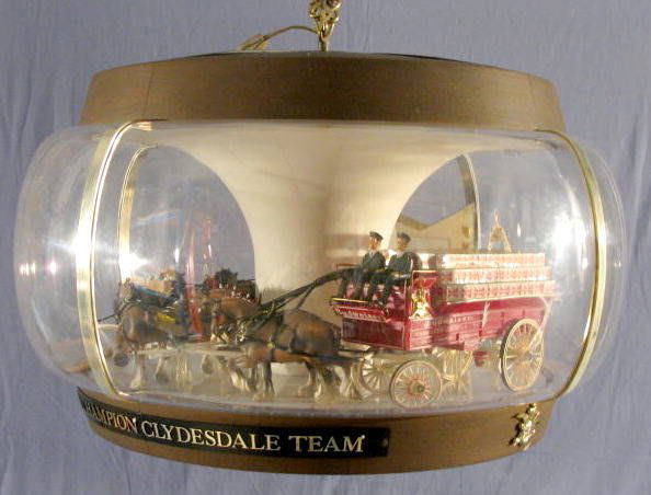 Budweiser Hanging Light w/Horses & Wagon: Budweiser Hanging Light w/Horses & Wagon: made of plastic. Not tested. No condition problems. 17 1/2" x 21" All items sell As Is, Where Is, no guarantees of any kind. We accept Mastercard & Visa, no p