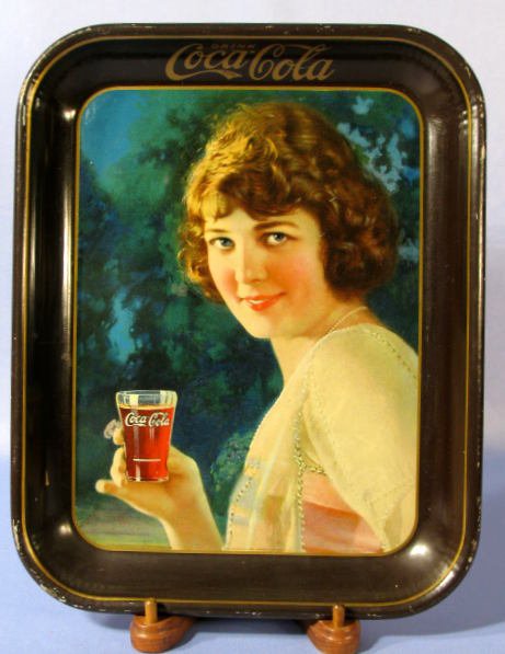 Coca Cola 1924 Tin Litho Serving Tray: Coca Cola 1924 Tin Litho Serving Tray: marked "Copyright The Coca Cola Co, The American Art Works, Coshocton, O" and "Made in U.S.A." (There is some scattered chips and wear on the edges. There is a s