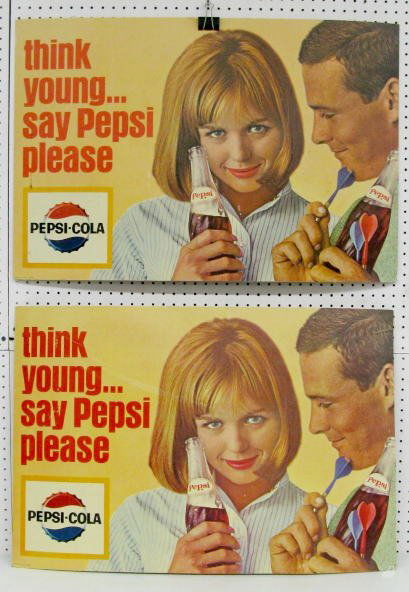 2 Pepsi Cola Cardboard Signs: 2 Pepsi Cola Cardboard Signs: a man with darts and a woman, both hold bottles of Pepsi. The "Say Pepsi Please" motto is included. (Both have crunched lower right corners. Also some light staining and