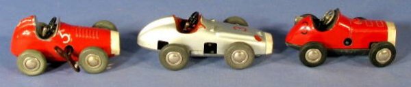 Group of 3 Schuco Key Wind Micro Racer Toys: Group of 3 Schuco Key Wind Micro Racers Toys: the rod on the left side is for adjusting the wheels angle. There is one key for all three. They all work well. 1.) Number 1041 is red. 2.) Number 1042 is