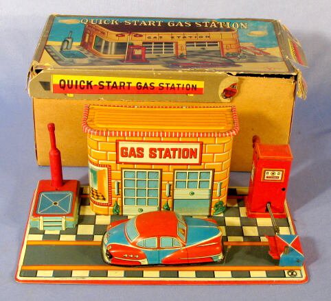 Japanese Quick Start Gas Station Tin Toy w/Box: Japanese Tin Quick Start Gas Station Toy w/Box: with trademark letter Y in a leaf shape. The small car attaches to the gas pump hose and is wound up. A button is pushed and the car races away. (Not wo
