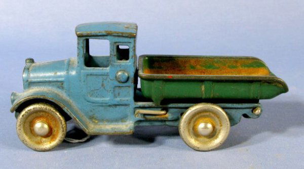 Kilgore Dump Truck Cast Iron Toy: Cast Iron Kilgore Toy Dump Truck: it is signed and the paint is original. (The green paint in the box is heavily worn. The cab and under carriage has some worn and chipped paint.) 6 3/4" l All items s
