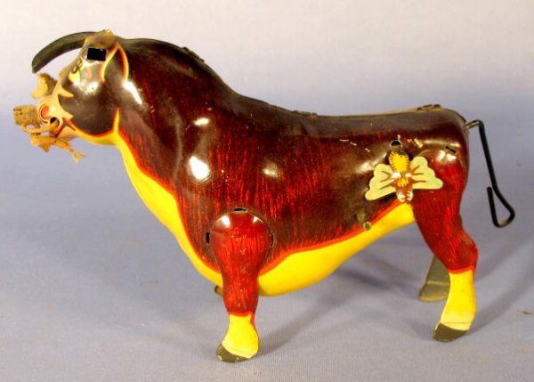 Marx Ferdinand the Bull Tin Windup Toy: Marx Tin Toy Windup Ferdinand the Bull: when wound, the tail rotates quickly as it tries to get rid of the insect on his hip. (One horn is missing, it seems to work just fine even though the key is ha