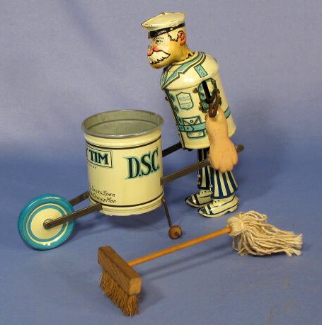 Marx "Tidy Tim" Street Cleaner Tin Windup Toy: Marx Tin Windup "Tidy Tim" Street Cleaner Toy: circa 1933. A mop and push broom are inside the trash can. (There is a small scratch here and there. Mainly on the arms and back.) 7 1/2" tall, in excell