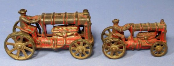 2 Arcade Fordson Cast Iron Toy Tractors: 2 Arcade Cast Iron Fordson Toy Tractors: they are not marked. At one time were painted red. The drivers are cast. (The paint is nearly all worn away.) 3 1/2" & 4 7/8" All items sell As Is, Where Is, n