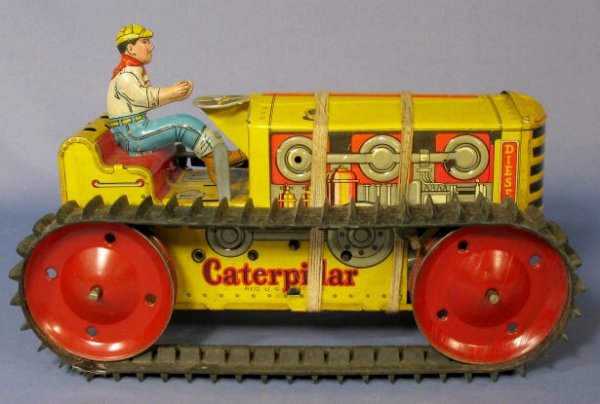 Marx Caterpillar Climbing Tin Friction Tractor: Marx Toy Tin Friction Caterpillar Climbing Tractor: marked Heavy Duty and with intact driver. (Not working very well. The bottom is tied on with string. The surface has some scuffs and scrapes.) 9 1/4