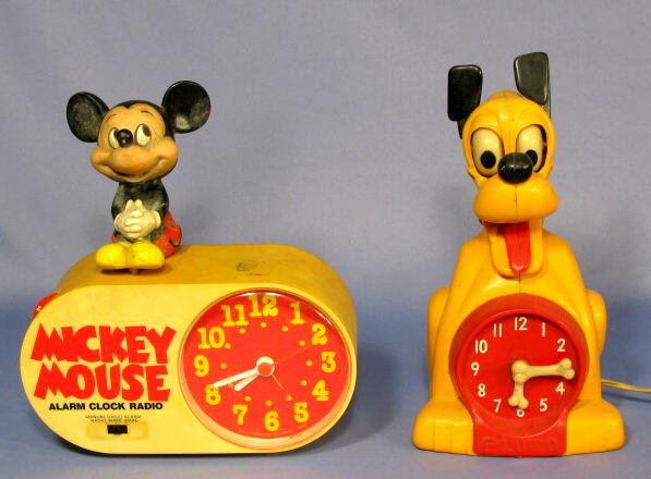 Mickey Mouse Clock/Radio & Pluto Clock: Mickey Mouse Clock/Radio & Pluto Clock: made of hard plastic, made by Concept 2000 and Allied Mfg. Co. The Mickey Mouse is battery operated. (Not working.) Pluto is a clock only. (Not working.) (Both