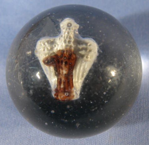 Sulphide Marble w/ a Buzzard: Sulphide Marble w/ a Buzzard: the birds back has been partially colored with a brown coloration, shaped like a No.1. Has a single pontil. (It has never been ground and has only a few tiny nicks. The s