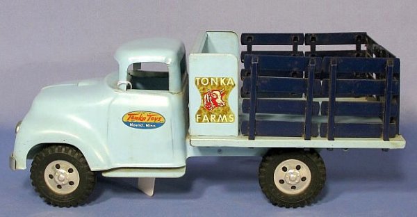 Tonka No. 04 1957 Tonka Farms Rack Toy Truck: Tonka Toy No.04 1957 Tonka Farms Rack Truck: made of steel and painted powder blue, with black racks. (There are only minor signs of use and dirt in the creases of the trucks bed. The mud flaps are go