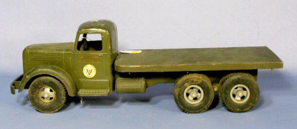 Smith Miller U.S. Army Flatbed Toy Truck: Smith Miller U.S. Army Flatbed Toy Truck: painted army green, it is made of white metal with a wood flatbed with 10 wheels. (There is minor scattered paint loss. The wheels are dirty. The metal is sou