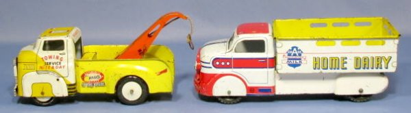 2 Tin Litho Toy Trucks: Marx & Wyandotte: 2 Tin Litho Toy Trucks: 1.) The Marx is Home Dairy, 11" long 2.) The Wyandotte is a tow truck and is 9 1/2" long (Both have scuffs and scrapes.) All items sell As Is, Where Is, no guarantees of any ki
