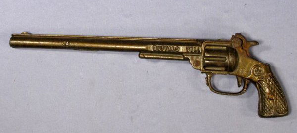 Kenton "Buffalo Bill" Cast Iron Toy Cap Gun: Cast Iron "Buffalo Bill" Toy Cap Gun by Kenton: circa 1925, it carries a patent date of Sept.11, 23. Marked S on one side of the grips, W on the other. It is a single shot. (There is some pitting from