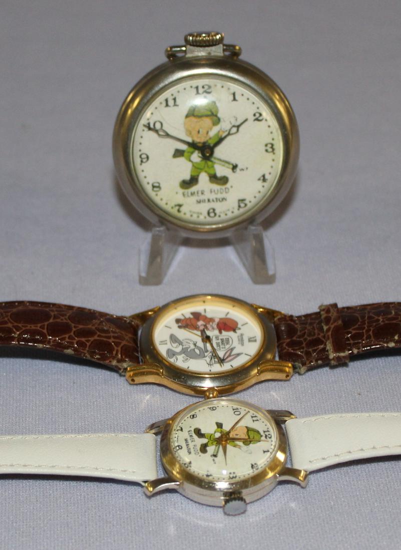 2 Elmer Fudd Wrist Watches & Pocket Watch: 2 Elmer Fudd Wrist Watches & Pocket Watch. 1- Pocket Watch- Made in USA is running 2- Wrist watch white bank is running. 3- 1993 Quartz wrist watch, not tested. **All watches are sold as is- where is