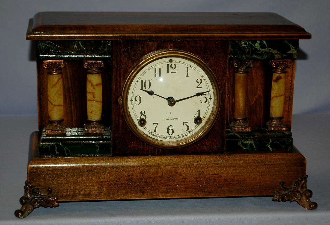 Antique Seth Thomas Adamantine Mantle Clock: Antique Seth Thomas Adamantine Mantle Clock: signed dial, brass T&S movement, wood case w/ 4 adamantine onyx columns, metal feet. 10 1/2" x 17"