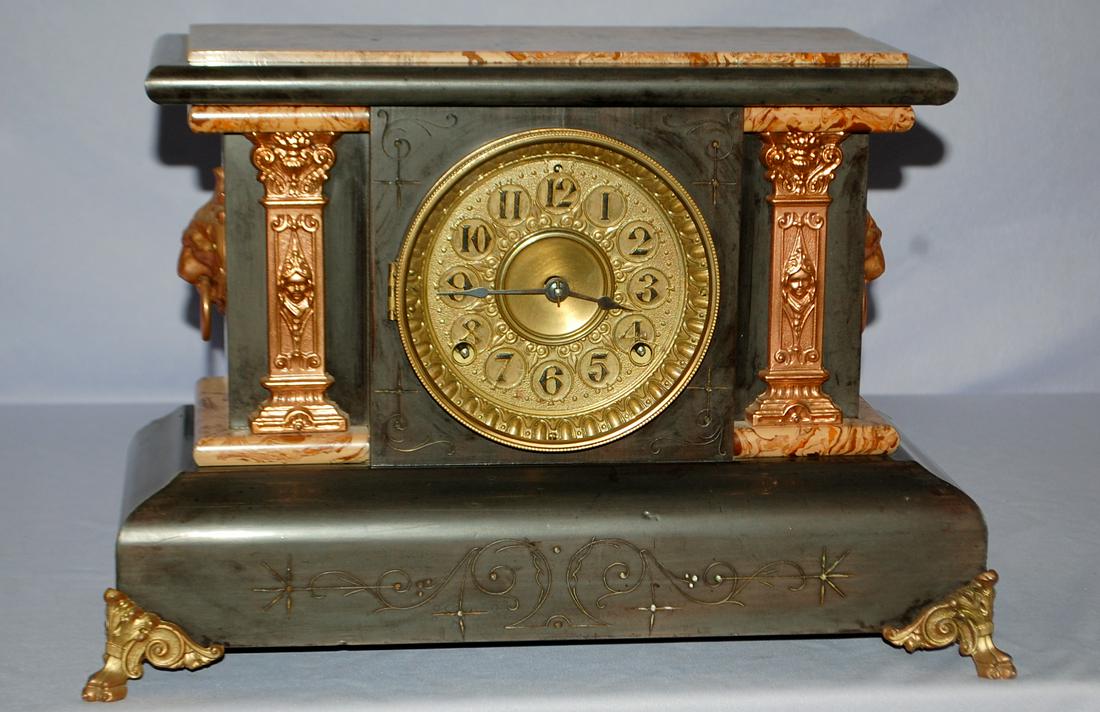 Antique Seth Thomas Adamantine Mantle Clock: Antique Seth Thomas Adamantine Mantle Clock: fancy dial, signed T&S movement, black enameled case w/ adamantine top & sides, bronzed metal columns and ornaments. 11" x 16 1/2"