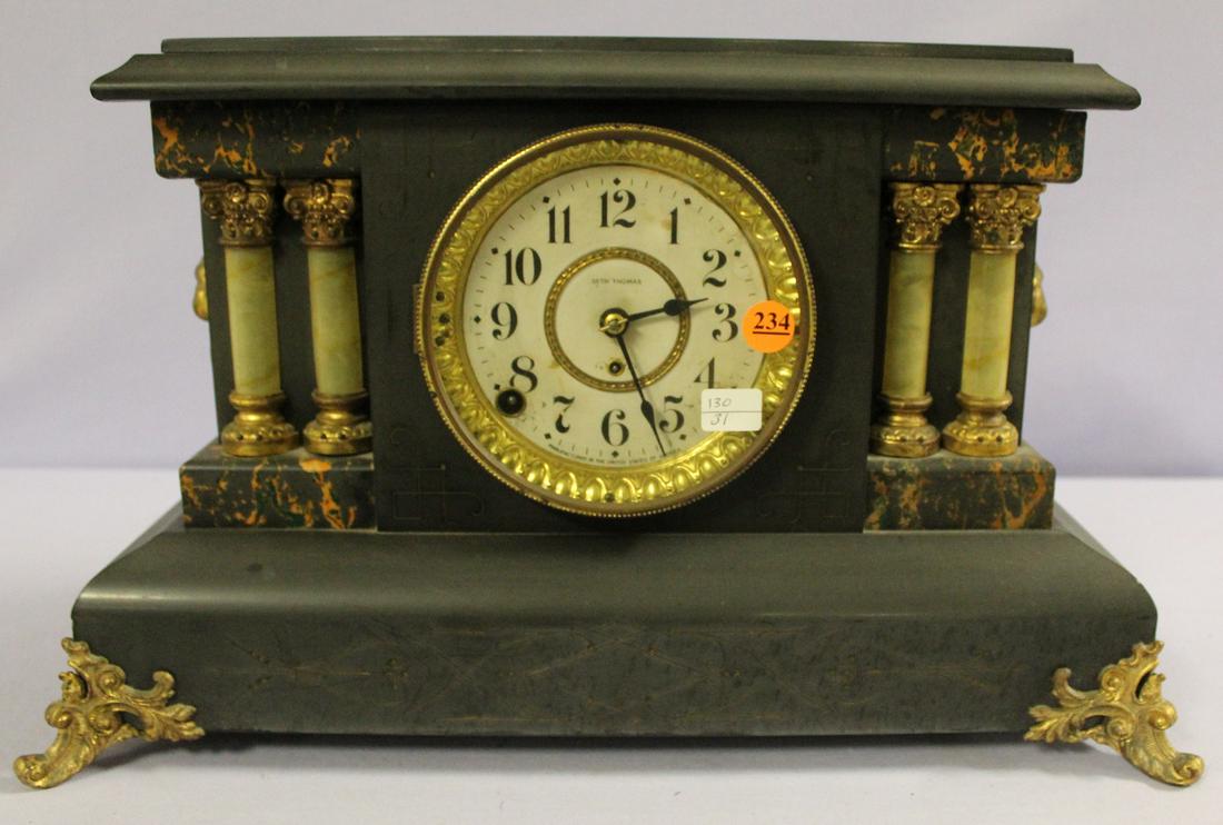Antique Seth Thomas Adamantine Mantle Clock: Antique Seth Thomas Adamantine Mantle Clock: signed dial, signed T&S movements w/ bell and gong strike, black enameled case, 4 onyx style columns, metal ornaments and feet, good label on the back. 11"