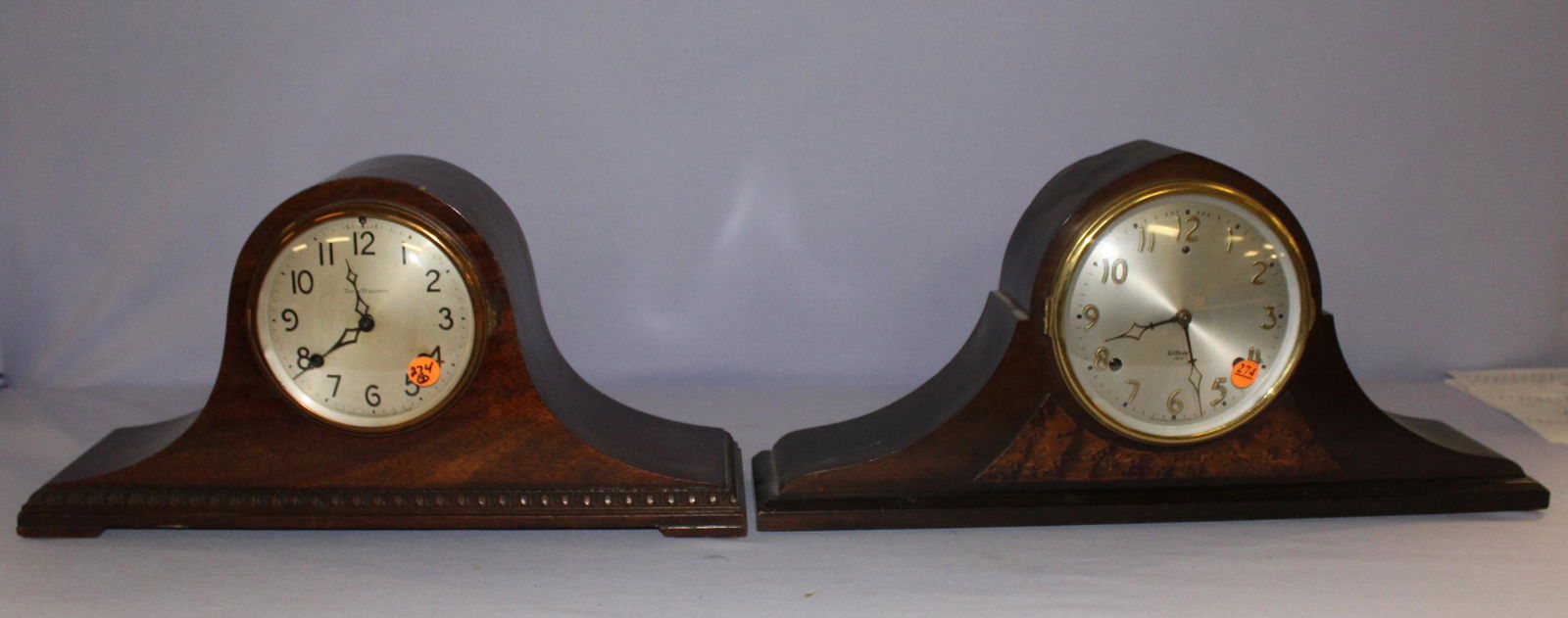 2 Mahogany Tambour Mantle Clocks: 2 Mahogany Tambour Mantle Clocks: 1) Gilbert mahogany inlay, silvered dial, T&S movement, 2 bar strike. 2) Sessions, silvered dial, mahogany case, convex glass.